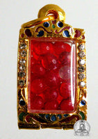 Red Sarira relic beads in a golden reliquary. #92
