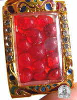Perles reliques Sarira rouges dans un reliquaire doré. # 92
